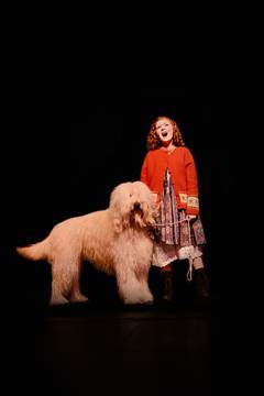 Torrence Brown on stage with a very large dog.