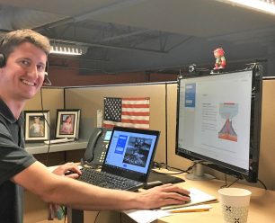 Matthew Armstrong smiling in his office space.