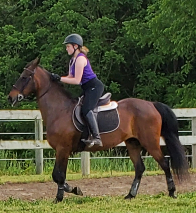 Bella training her horse