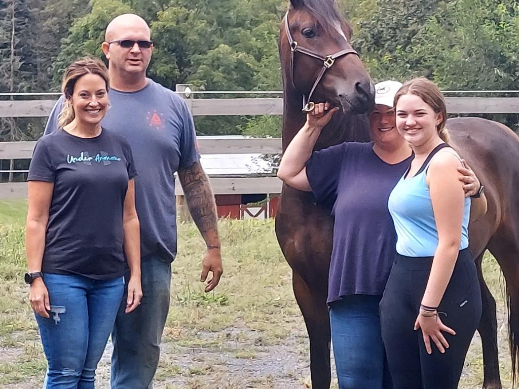 Bella's family with her horse