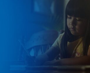 student doing homework at a table