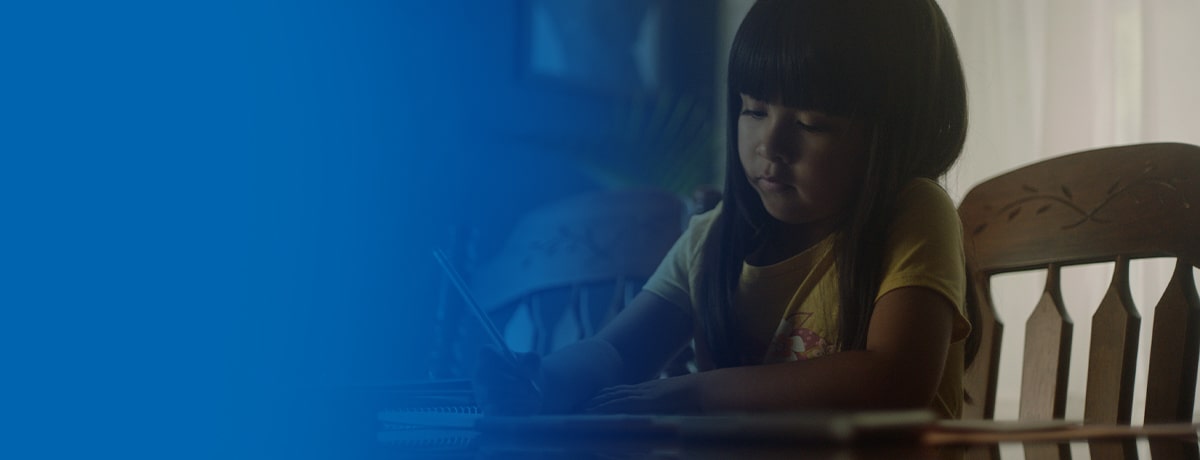 student doing homework at a table