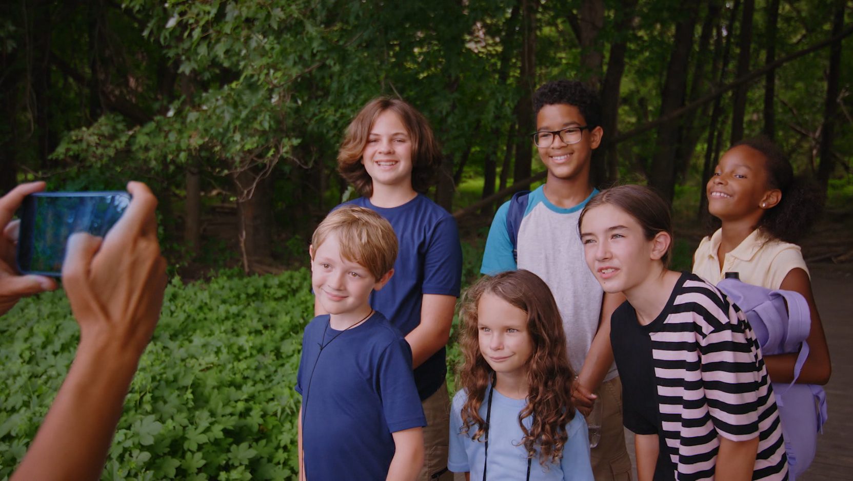 Kids on a field trip, posing for a group photo