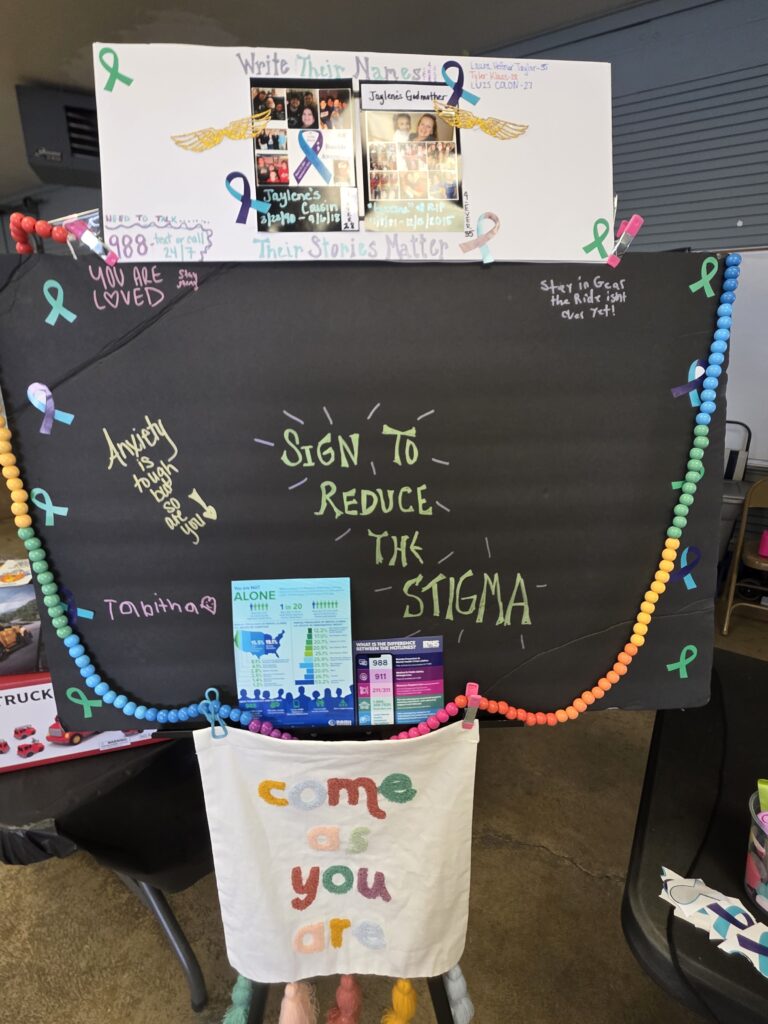 A poster signed by various community members to support ending the stigma for mental health struggles.