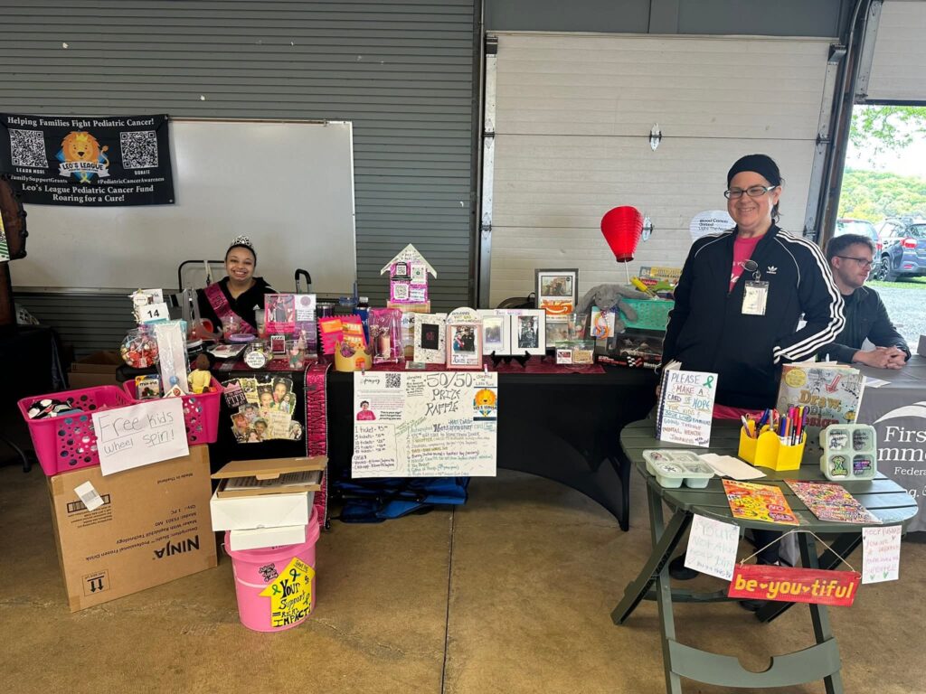 Jaylene hosts a booth at a community event to spread awareness about mental health.